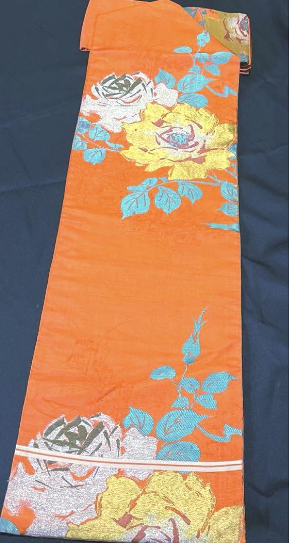 未使用名古屋帯【帯６】オレンジ地の花柄模様の名古屋帯 - メルカリ